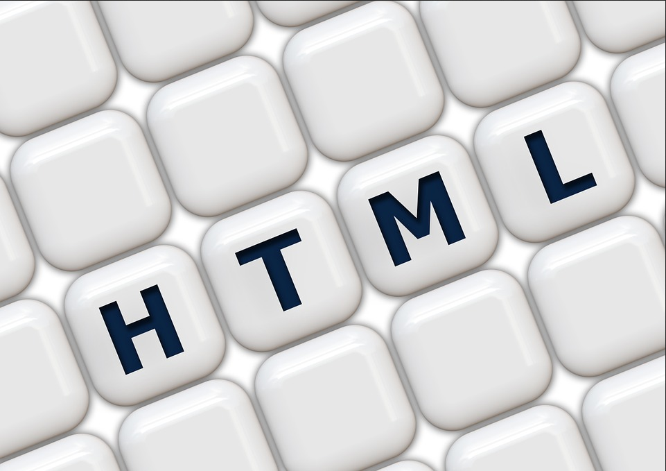 An image of tiles showing the letters HTML